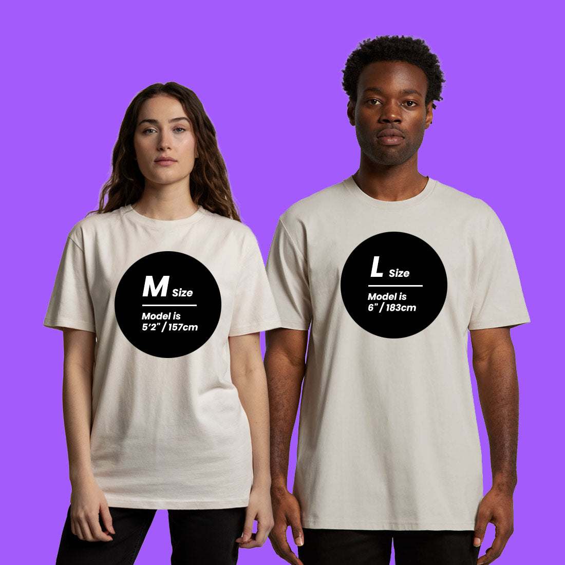 Two people wearing beige t-shirts with size labels on a purple background